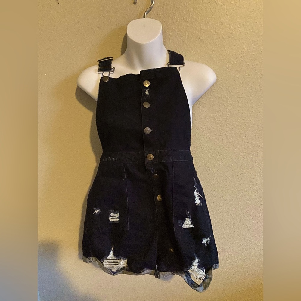 Ripped jean overalls